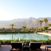 Luxurious pool surrounded by gardens at Four Seasons Marrakech.
