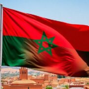 Moroccan flag against a backdrop of vibrant scenery.