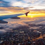 Airplane flying from Manchester to Marrakech at sunset