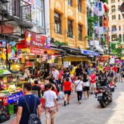 Kuala Lumpur street scene with bustling markets and local architecture.