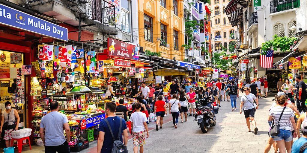 Kuala Lumpur street scene with bustling markets and local architecture.